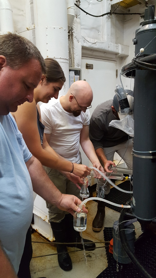 From left to right, Chuck, Leah, CFCs Chuck, and Ian working in close quarters to get their water samples