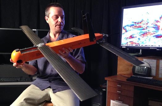 Dr. Joe Cione holds the Coyote UAS