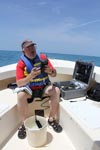 Dr. Chris Sinigalliano tests the water quality with a portable YSI meter. Image credit: NOAA