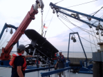 Preparing the wave glider for deployment. Image credit: NOAA