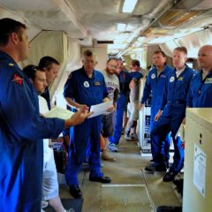Pre-launch schedule and safety briefing on the P3 Hurricane Hunter aircraft. Image credit: NOAA