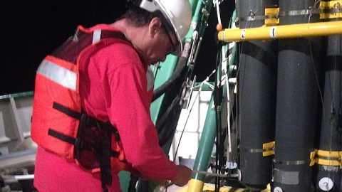 AOML scientist Robert Roddy takes a sample from a CTD cast. Image credit: NOAA.
