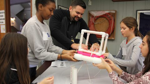 Students work together to construct their own ocean drifters. Image credit: NOAA