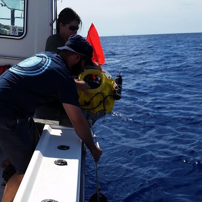 AOML oceanographer Andy Stefanick deploys the dropsonde at one of the stations during the 100th successful dropsonde cruise on October 15, 2015.
