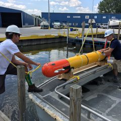 Loading eAUV onto the boat for launch. Photo Credit: NOAA.