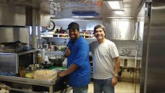 Cooks Emir Porter and Orcino Tan during lunch preparation. Photo Credit: NOAA.