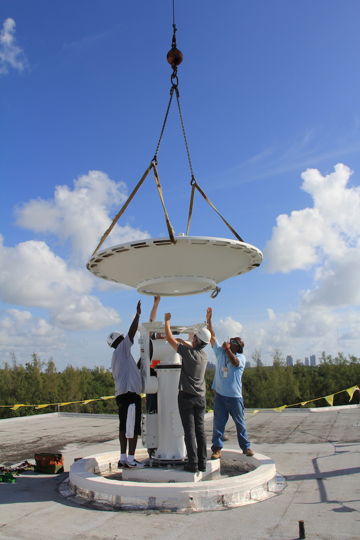 The reflector is lowered onto the positioner. Image credit: NOAA