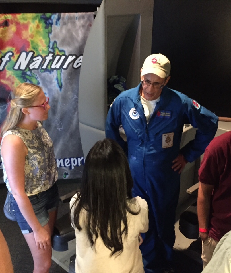 AOML hurricane researcher talks with a museum visitor. Image credit: NOAA