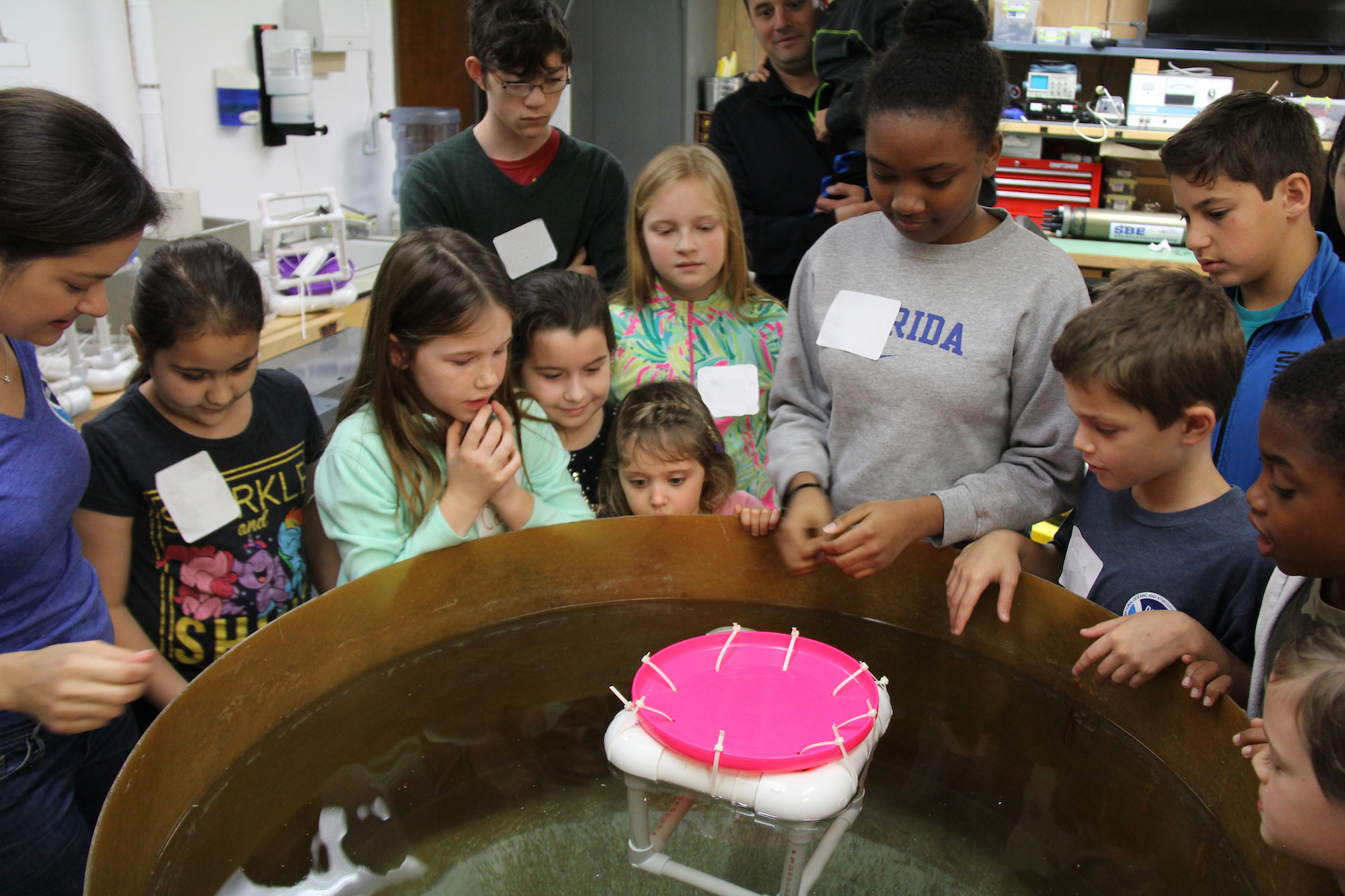 Students watch as their ocean drifters are tested for buoyancy and ability to hold a payload. Image credit: NOAA