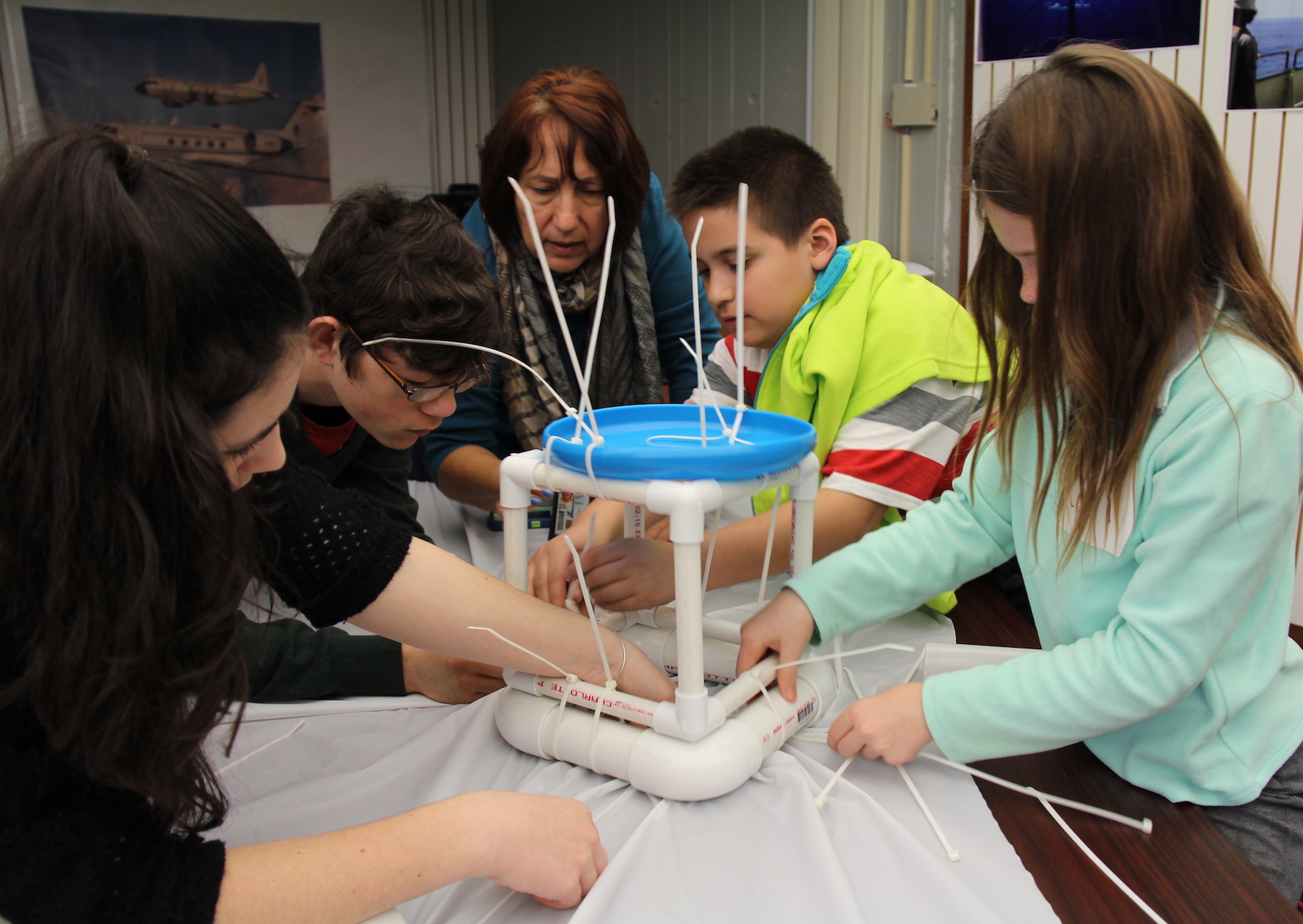 Students work together to construct their own ocean drifters. Image credit: NOAA