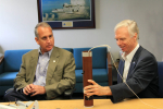 AOML's Director Dr. Robert Atlas briefs Congressman Diaz-Balart on the use of a GPS dropsonde in hurricane research. Image credit: NOAA