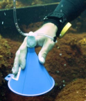 A funnel is used to collect carbon dioxide gas bubbles from the seeps near the coral reefs at Maug. Image credit: NOAA