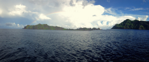 A rainbow forms inside the Maug caldera. Image credit: NOAA