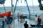 Crew prepares wave glider for deployment. Image credit: NOAA