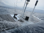 A wive glider dives under the waves after being deployed. Image credit: Liquid Robotics