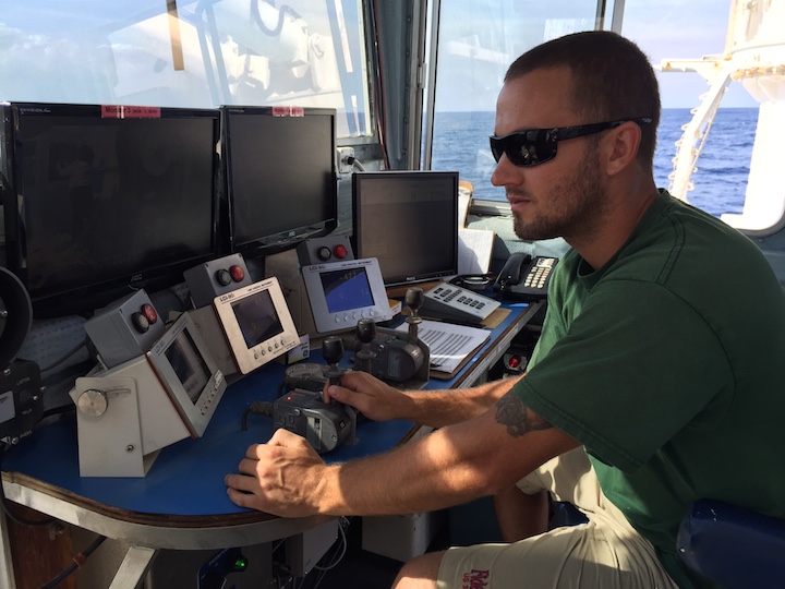 Ethan Irons is one of the three crew running the winch to owed the CTD, The crew runs 24 hour watches: 4 hours on and 8 hours off. Image credit: NOAA.