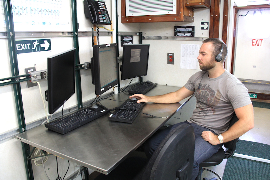 PhOD's Jay Hooper reviews the real time oceanographic data collected on previous surveys. Image Credit: NOAA