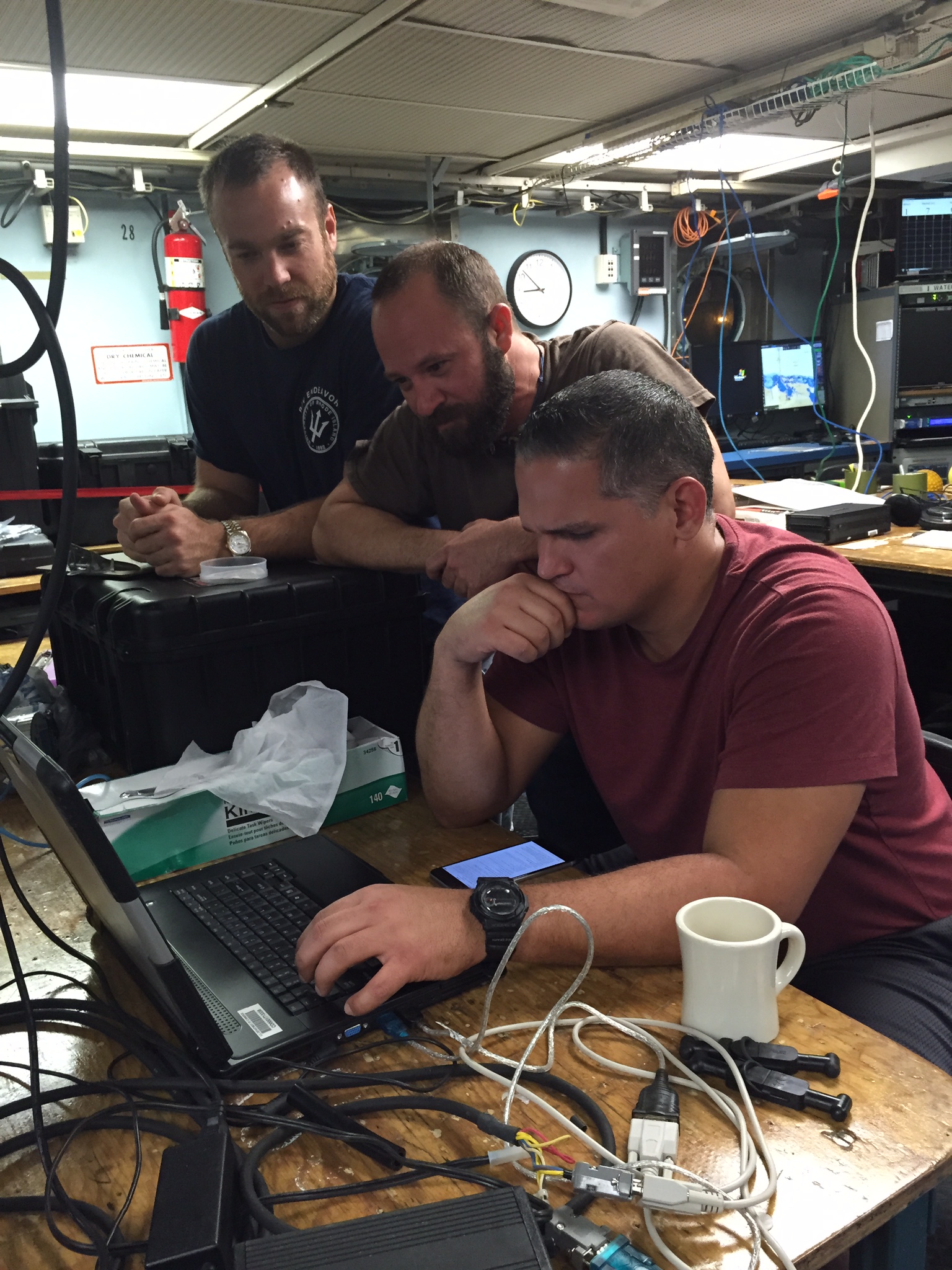 The team reviewing the CTD data on R/V Endeavor. Image credit: NOAA