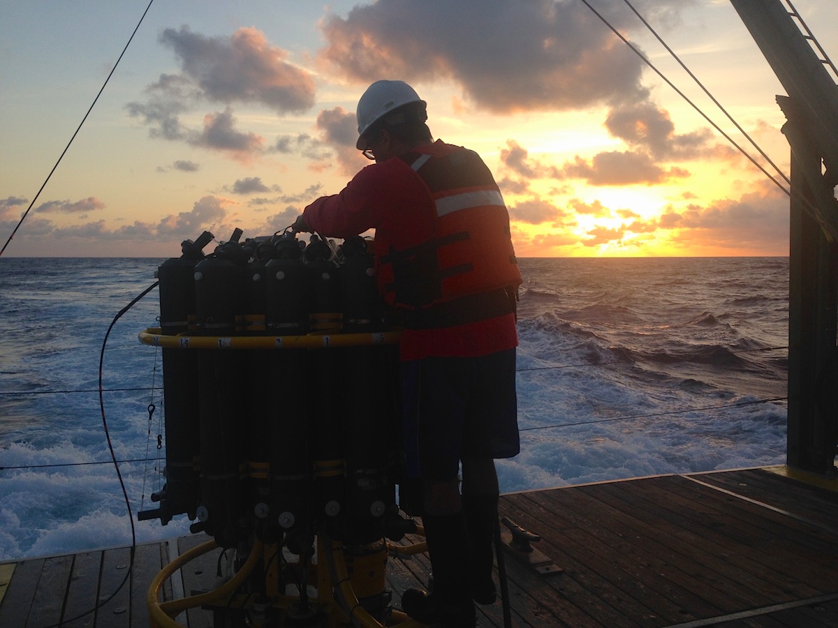 AOML scientist Robert Roddy hoses down the CTD after its final deployment of the day. Image credit: NOAA
