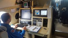 Flight Director Mike Holmes aboard one of four missions into Harvey. Image credit: NOAA