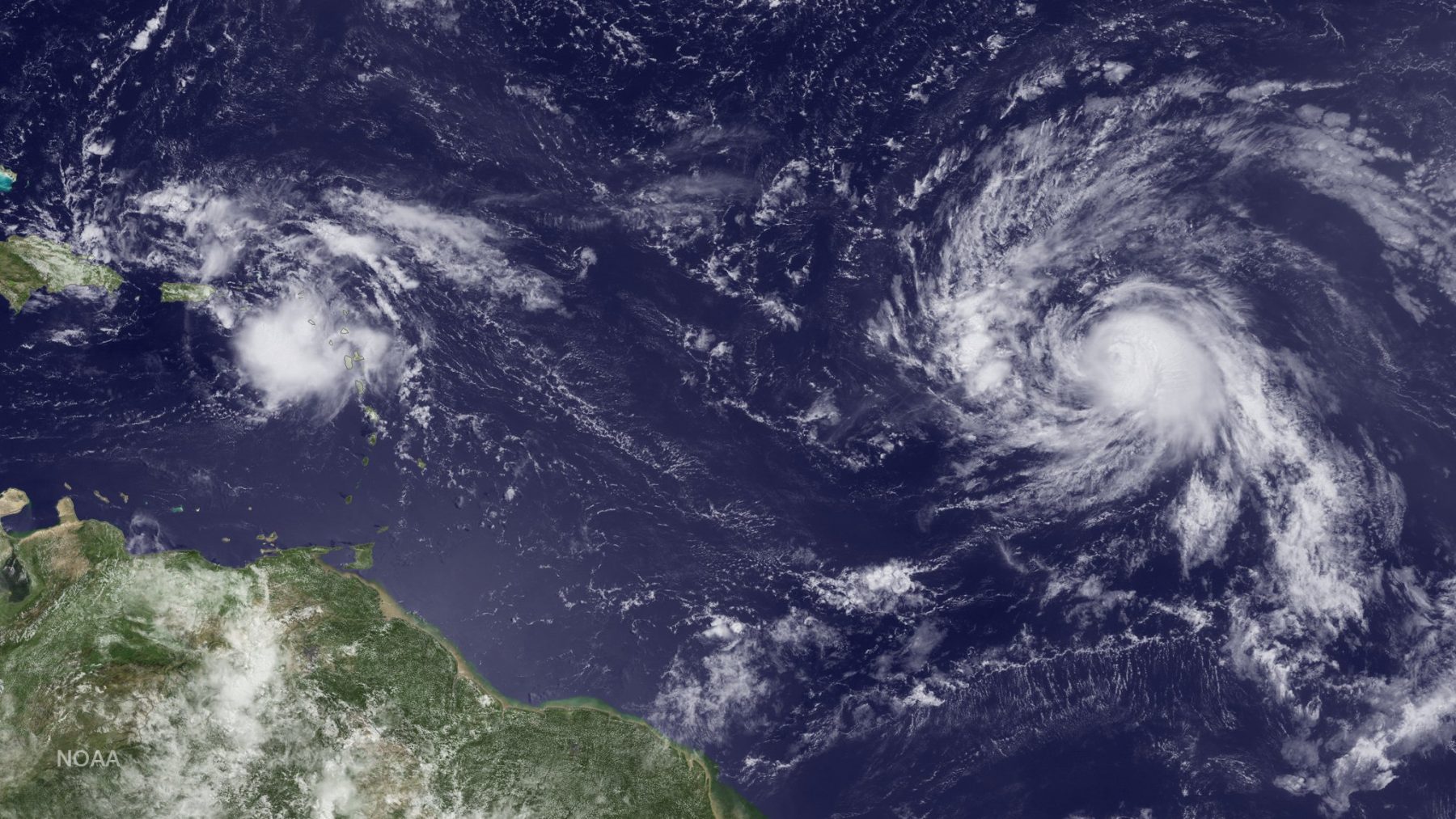 AL99 (left) and Gaston (right) observed in the Atlantic. Image credit: NOAA
