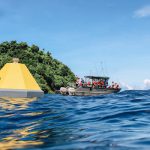 National Park Service staff visit the newly deployed ocean acidification buoy in Fagatele Bay, in the National Marine Sanctuary of American Samoa.