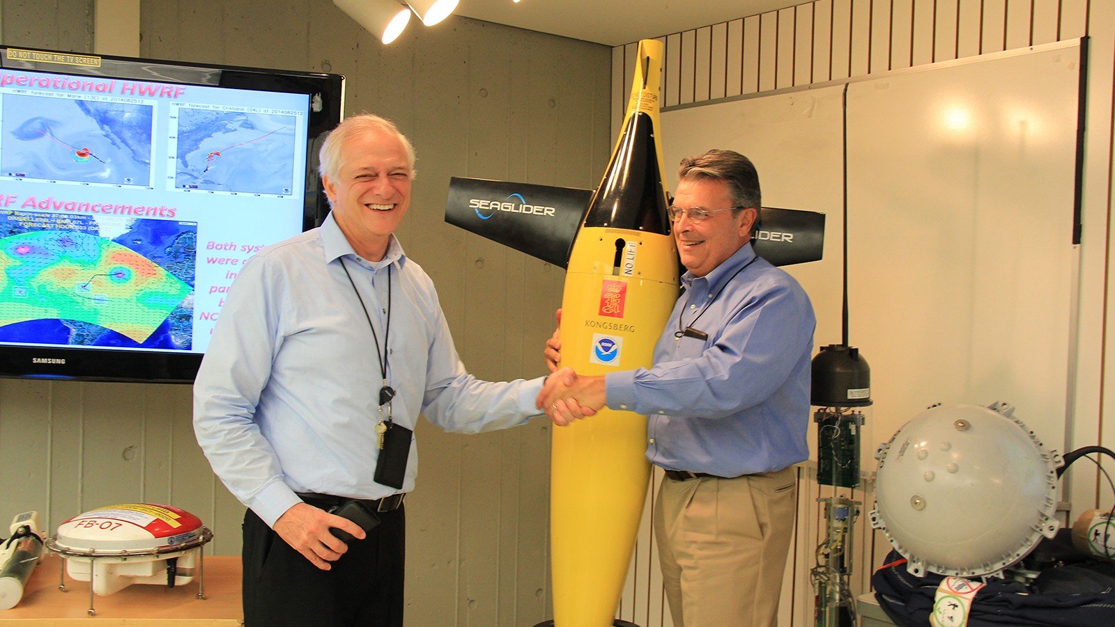 Craig McLean and Gustavo Goni with Hurricane Glider. Photo Credit: NOAA