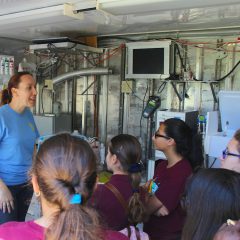 An AOML researcher tours the SOMMA van with a group of students. Image credit: NOAA