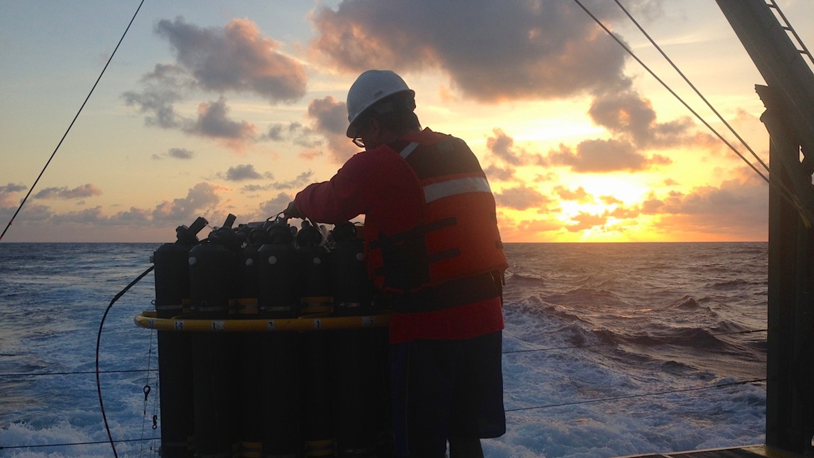 AOML scientist Robert Roddy hoses down the CTD after its final deployment of the day. Image credit: NOAA