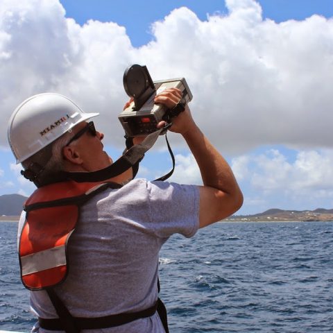 Dan Otis of the University of South Florida measures remote-sensing reflectance with a spectro-radiometer, which measures individual wavelengths of light. Image credit: NOAA