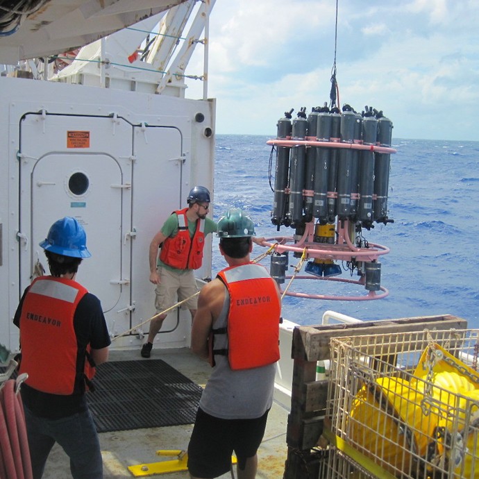 AOML scientists work with members of the ships' crew to recover the CTD rosette at the end of a 3 hour hydrographic cast. Image credit: NOAA