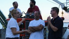 Scientists sharing a laugh aboard the ship. Image credit: NOAA