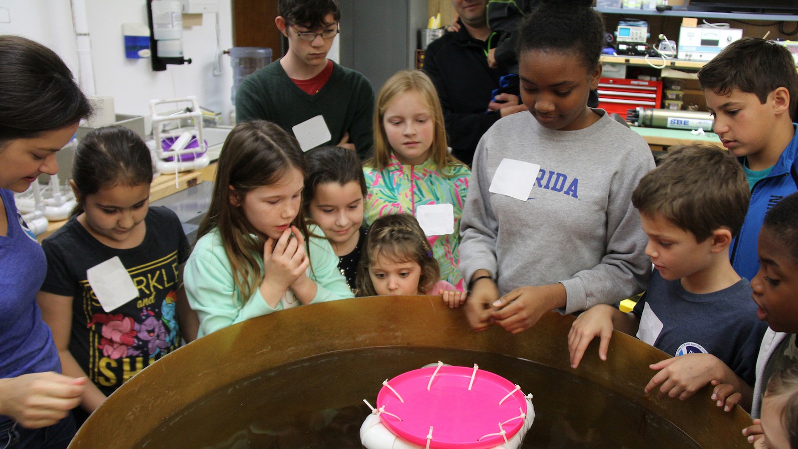 Students watch as their ocean drifters are tested for buoyancy and ability to hold a payload. Image credit: NOAA