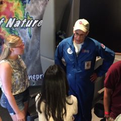 AOML hurricane researcher talks with a museum visitor. Image credit: NOAA