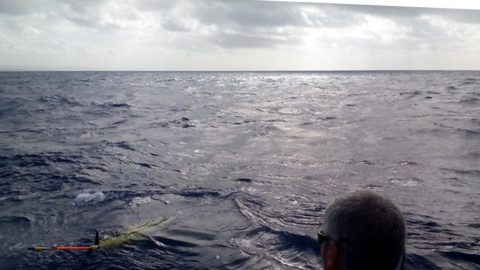 The recovery team pulls up alongside the glider. Image credit: NOAA