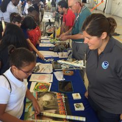 AOML Scientist Heather Holbach teaching visitors about hurricane data collection. Image credit: NOAA