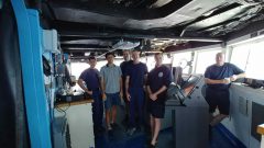 From left to right: CDR. Daniel Simon, Denis Volkov (Chief Scientist of I07N), Lt. Brian Elliot (Operations Officer), CAPT. Kurt Zegowitz (Commanding Officer), Ens. Michael Fuller, and CDR. James McEntee (Medical Officer). Photo Credit: NOAA.