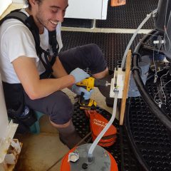 Christian sampling black carbon, looks like a pretty involved process. Photo Credit: NOAA.