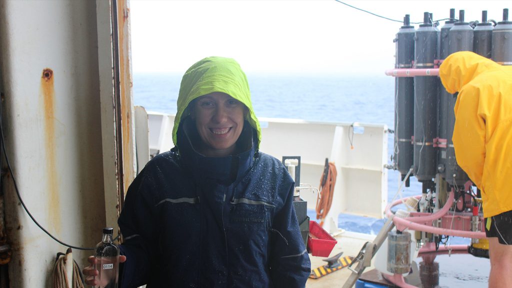 Leticia Barbero (University and Miami and NOAA AOML), chief scientist on the Gulf of Mexico and East Coast Carbon Cruise, holding a sample from the CTD.