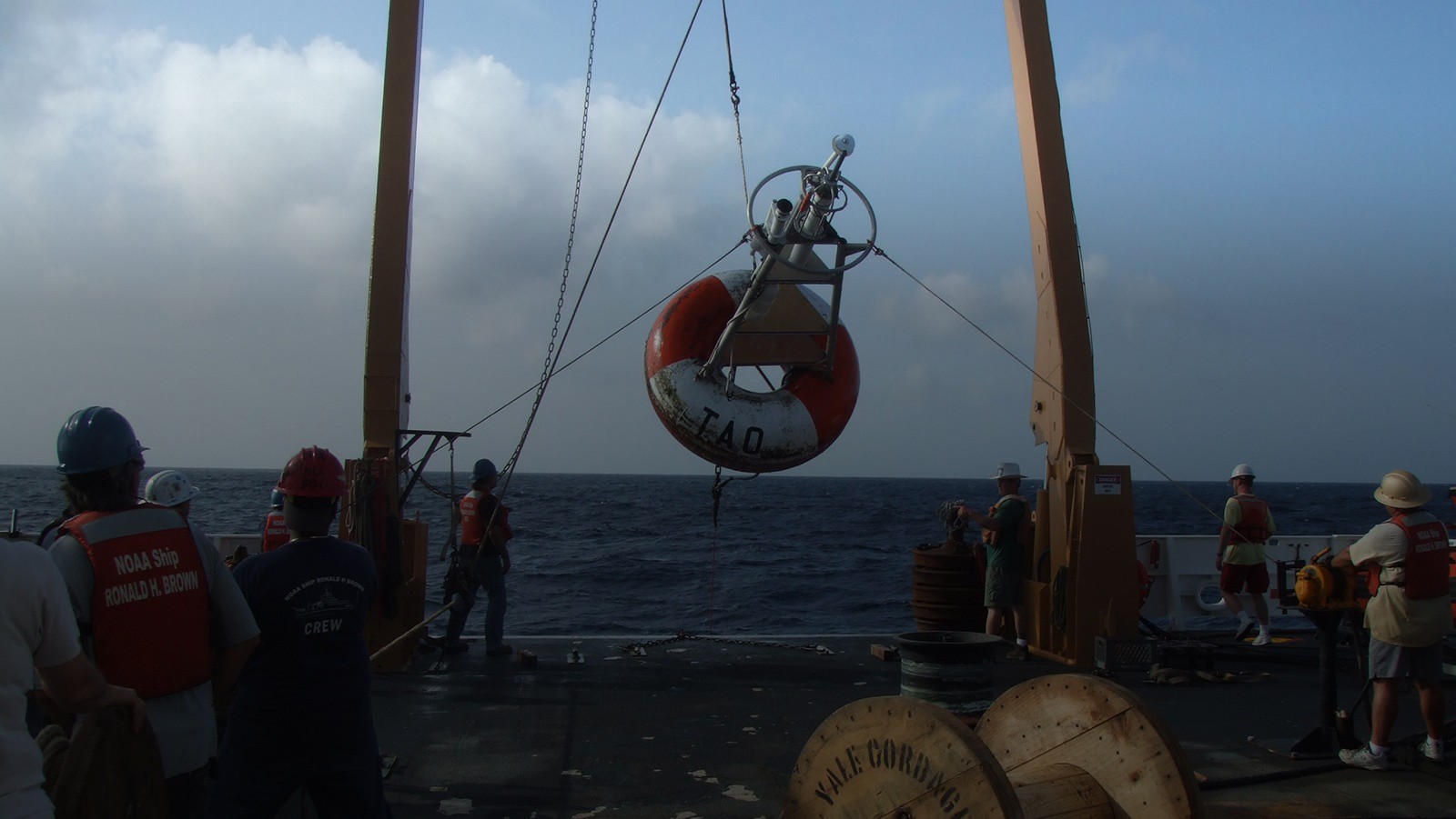 Tropical Atlantic Variability header photo. A buoy deployment.