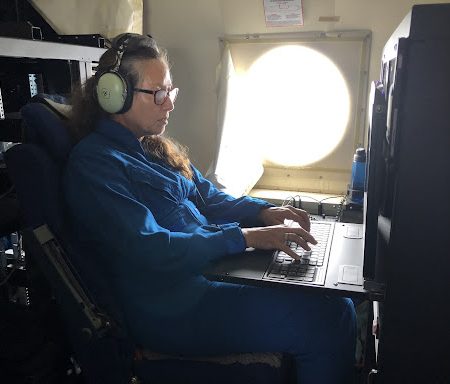 AOML Hurricane researcher Kathryn Sellwood processing dropsonde data on a research mission into Hurricane Fiona in September 2022.