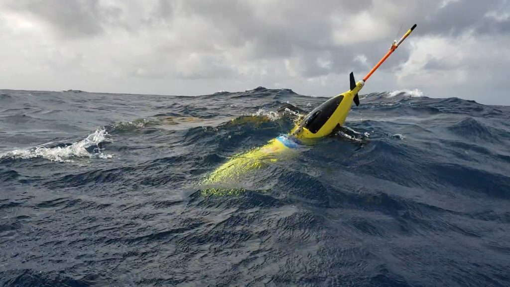 An image of a hurricane glider deployed in the ocean to gather temperature, salinity, and dissolved oxygen observations.
