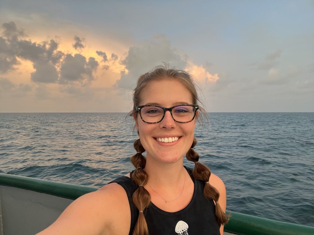 Color selfie of Tyler Christian on a research vessel at sea