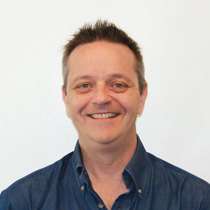 Color portrait of Joe Cione against a white background.