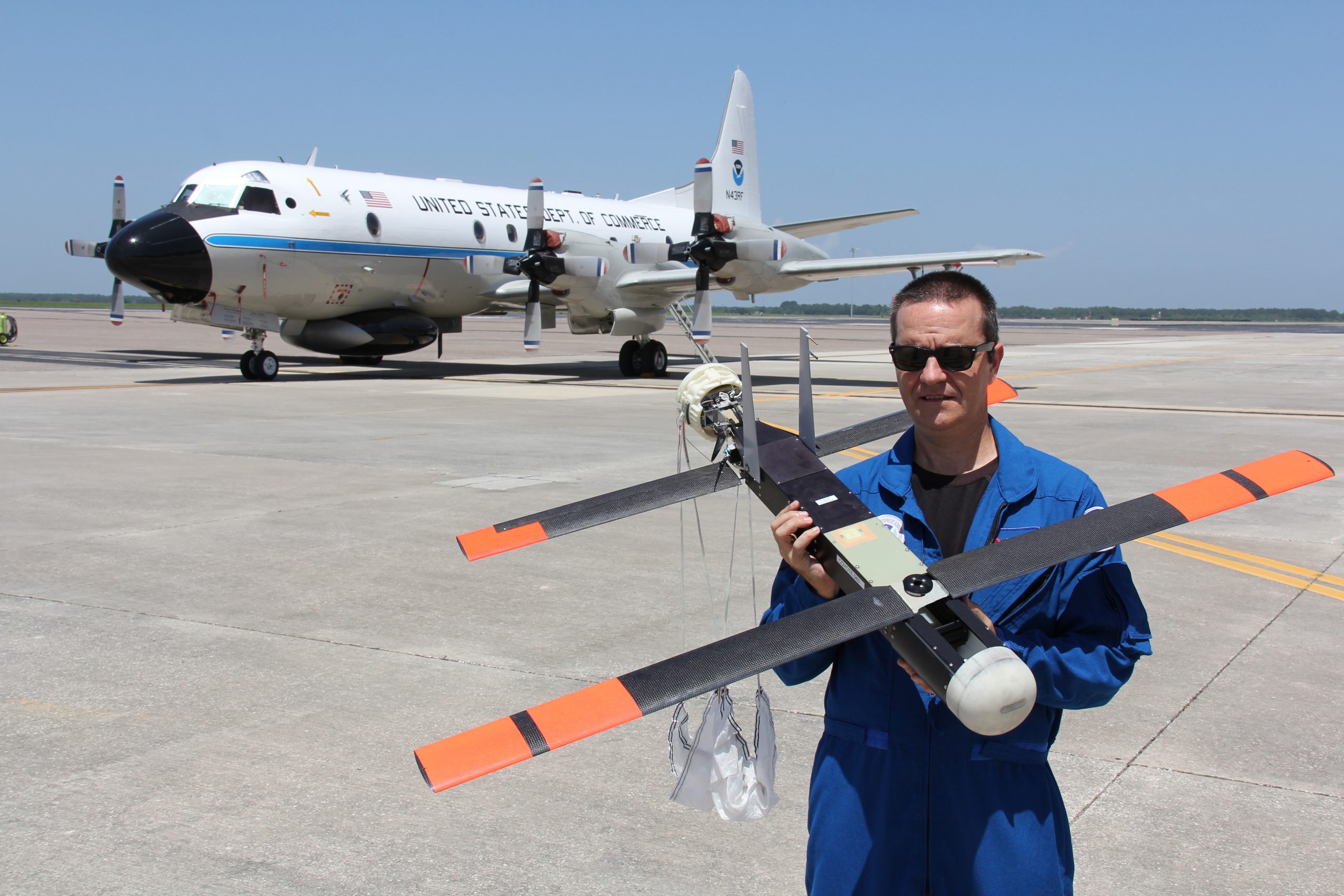joe-cione-and-coyote-uas-with-p-3-on-tarmac-at-macdill-afb-credit_-noaa.jpg